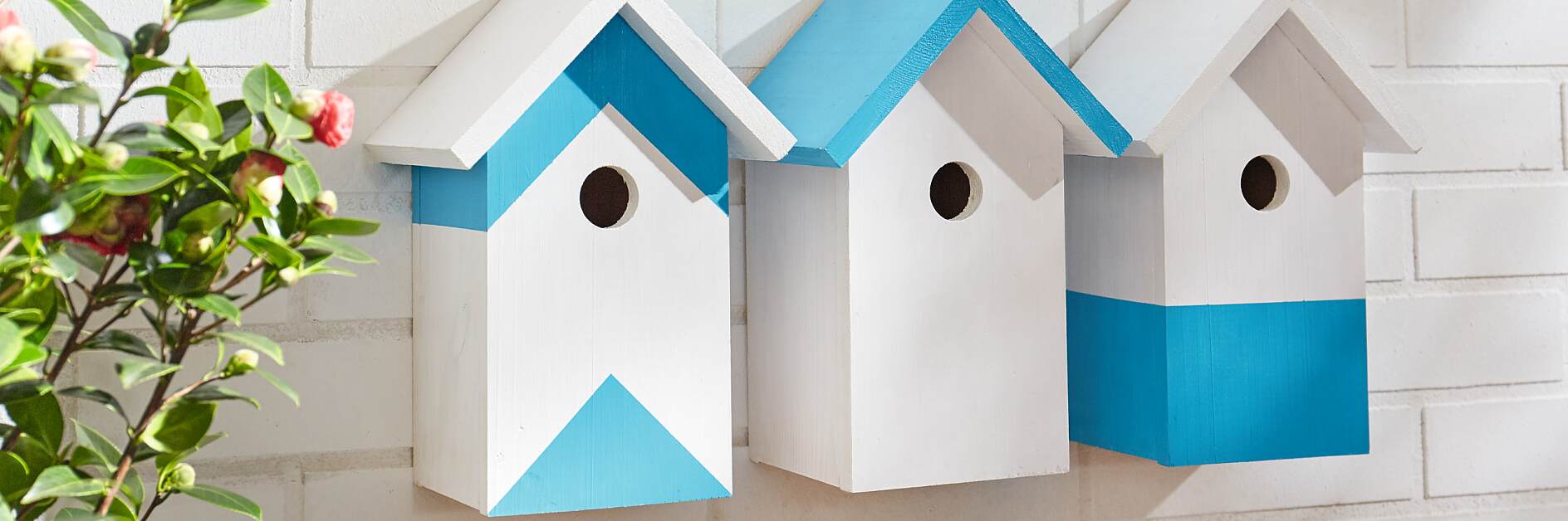 Create a row of stylish wooden bird houses