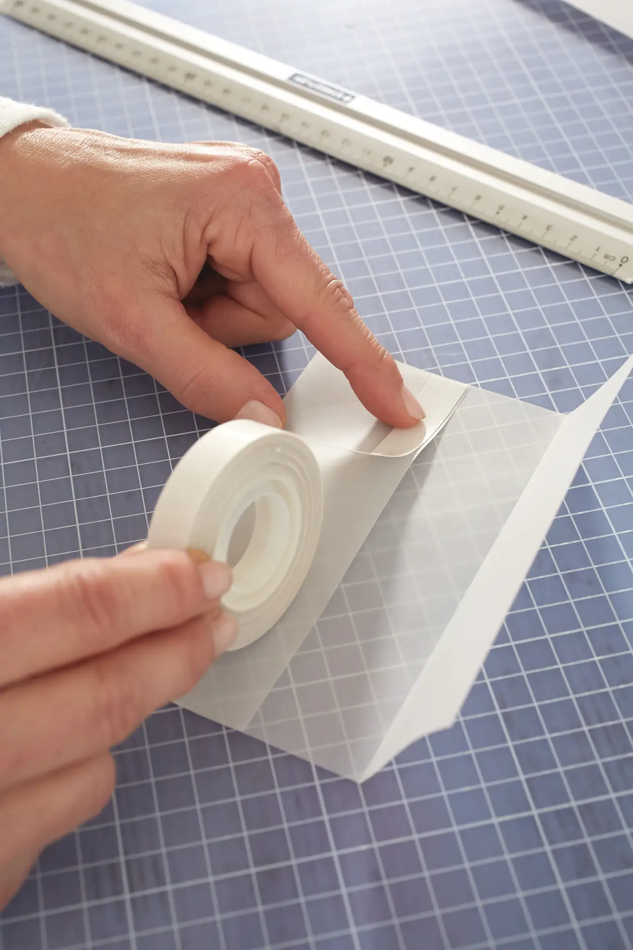 Apply a strip of double-sided adhesive tape.