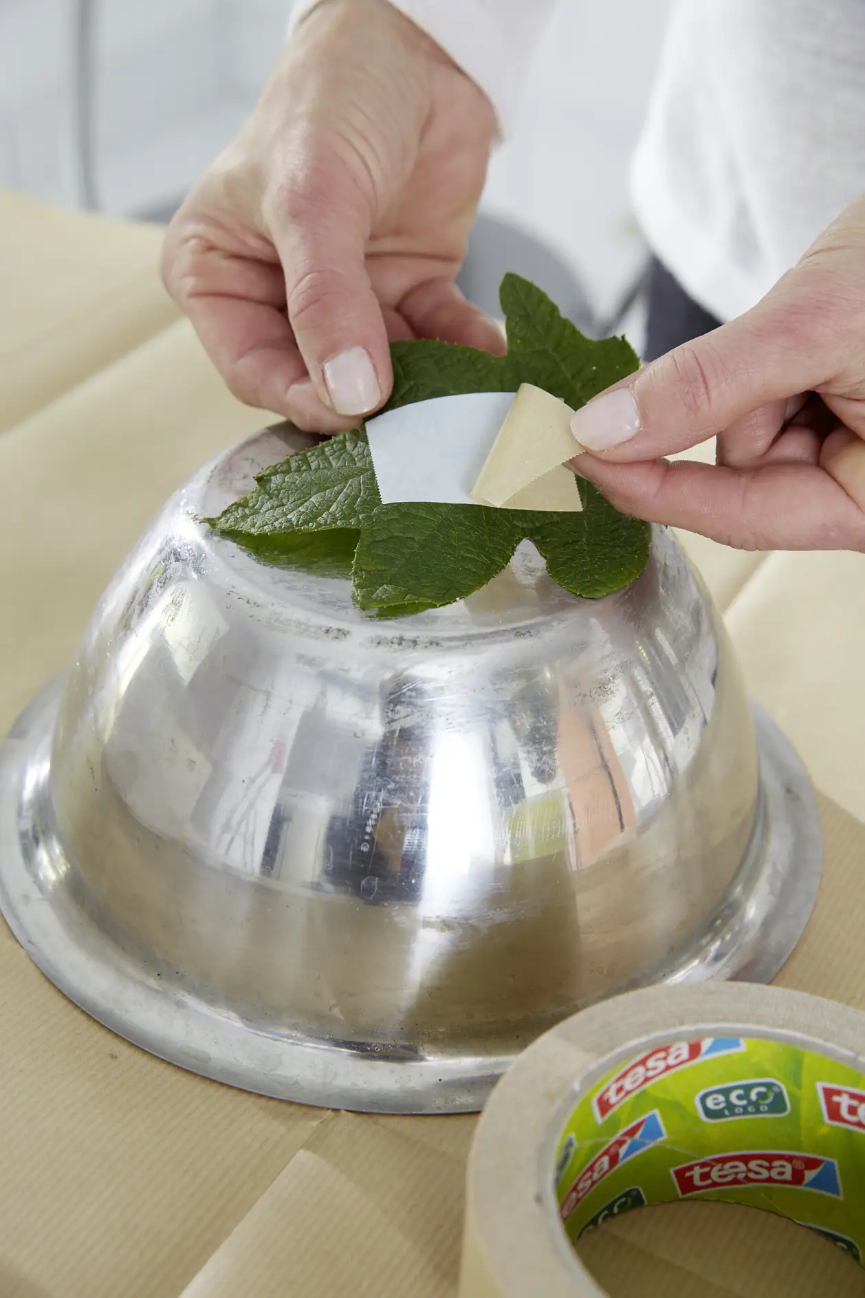 Fix the leaf to the underside of the smaller bowl, which is to sustain the inner form.