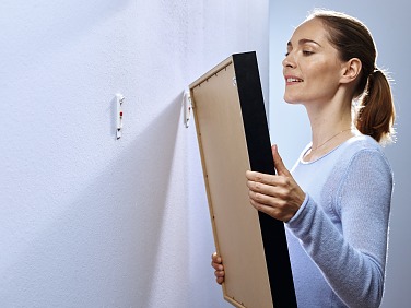 The tesa® Adjustable Adhesive Nail – ideal for evenly arranging pictures.
