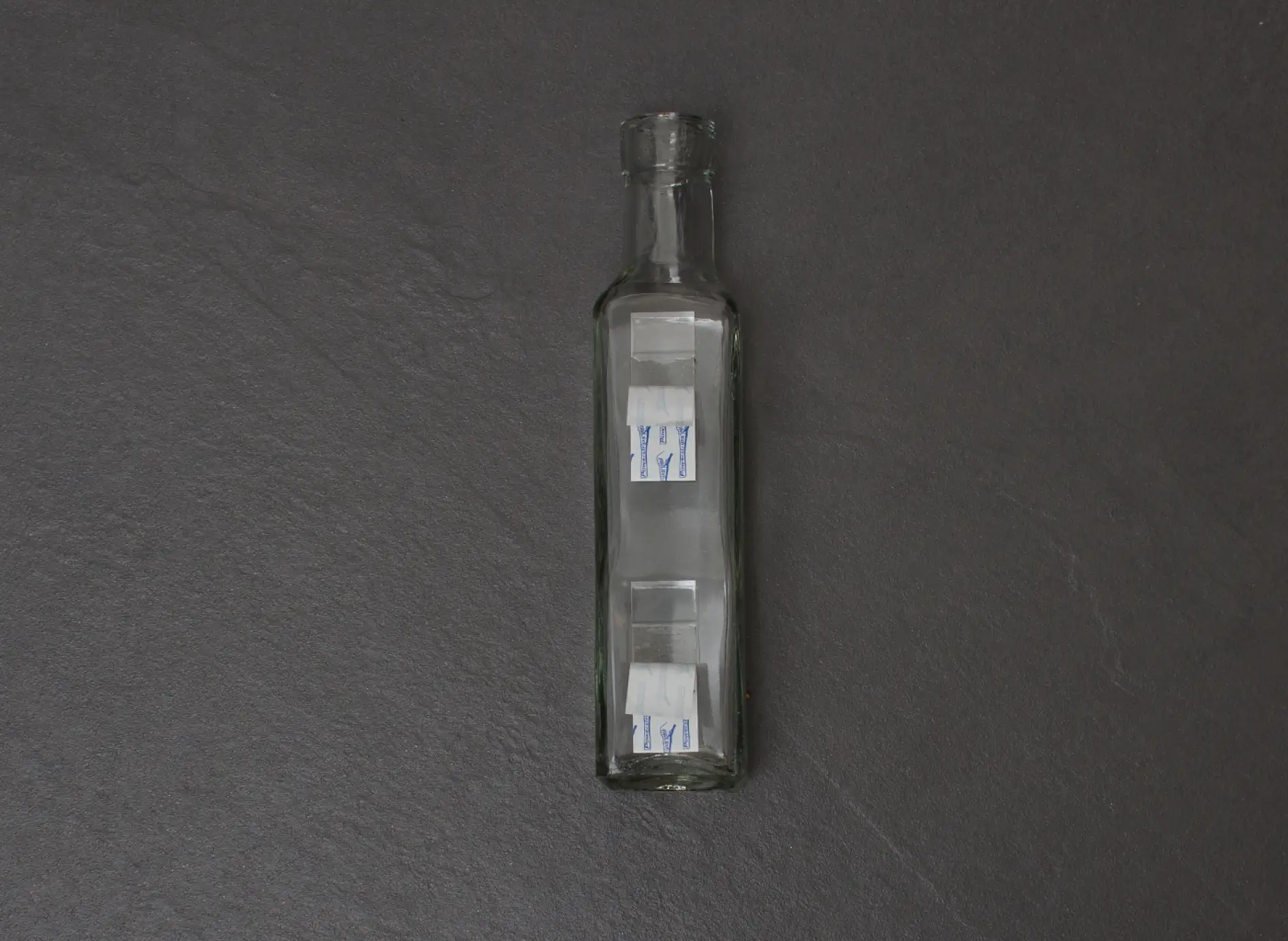 Attach the bottles to your chosen surface in the bathroom using tesa tesa Powerstrips® Strips Transparent Large.
