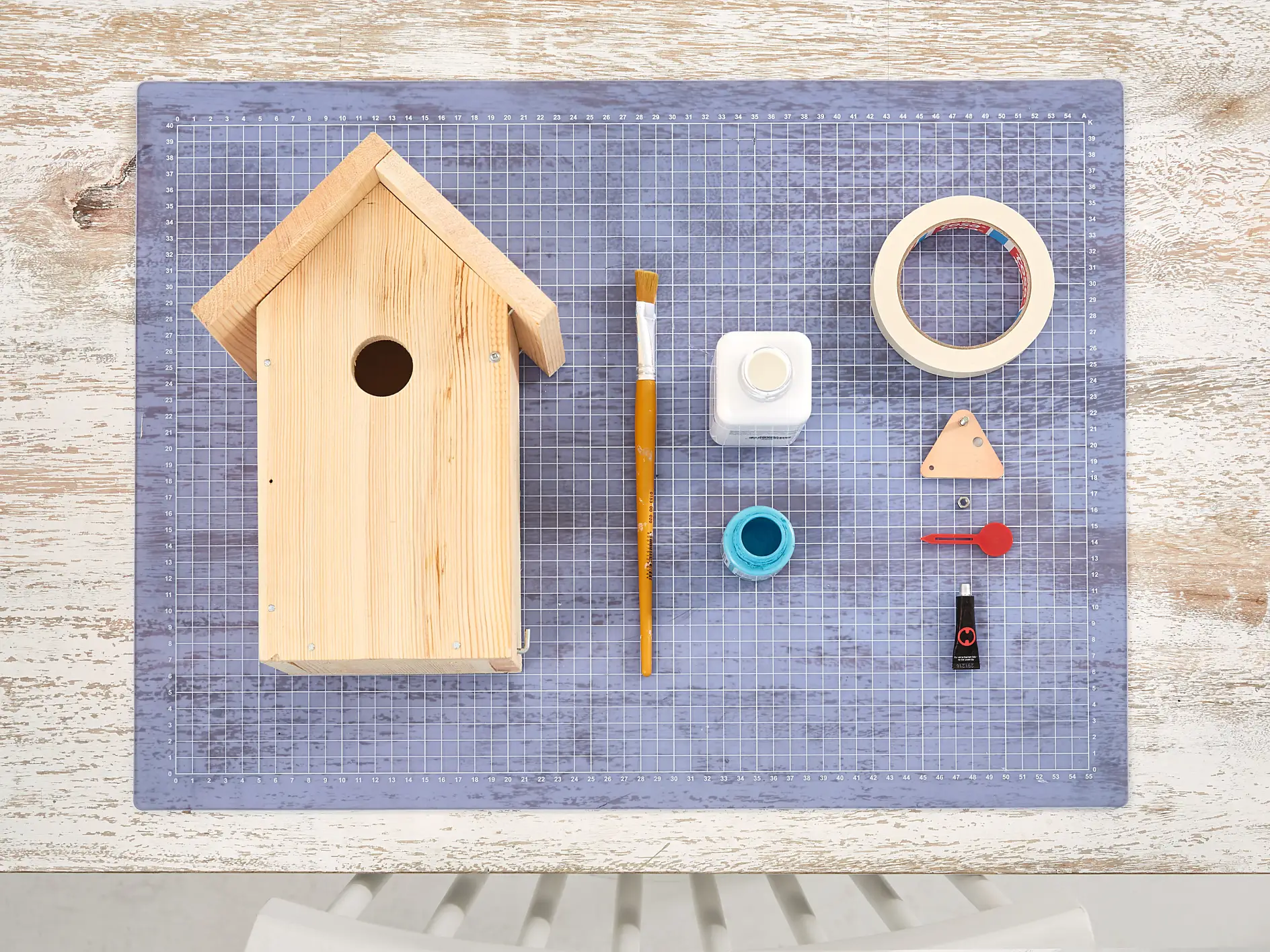 Overview of materials needed for painted wooden bird houses