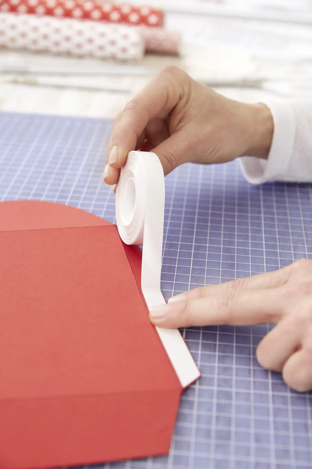 Apply a strip of double-sided adhesive tape