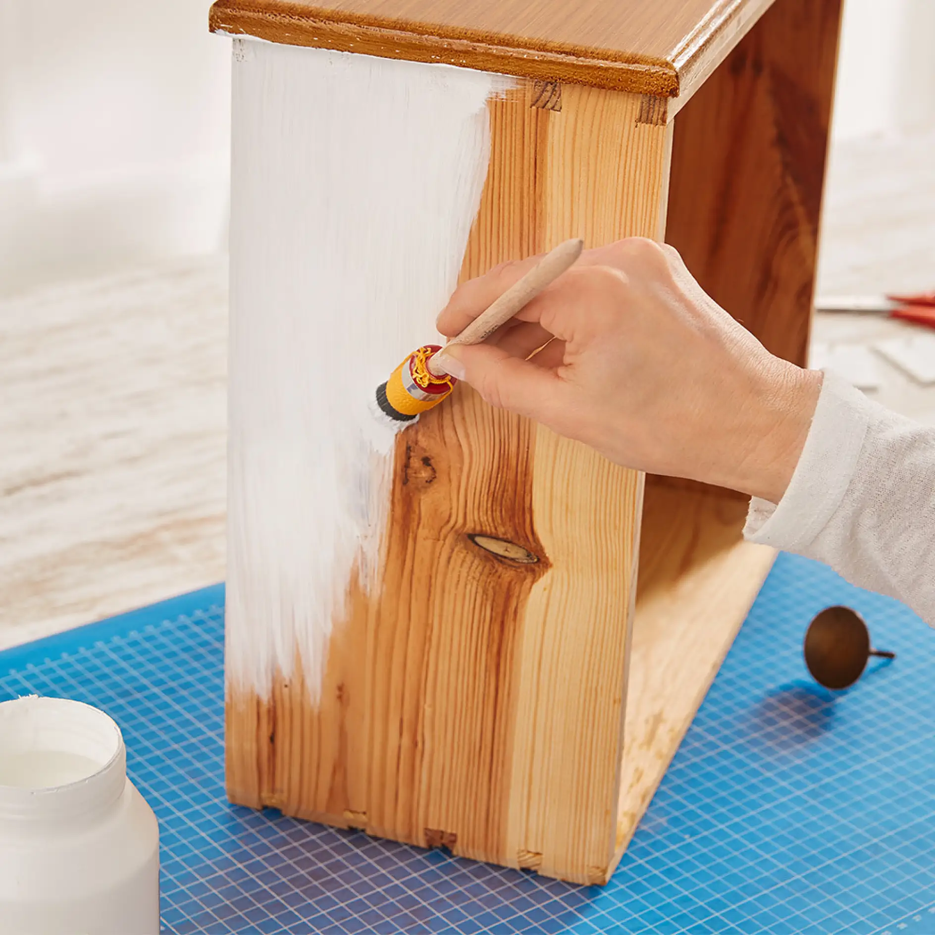 Painting a drawer to create a DIY bedside table