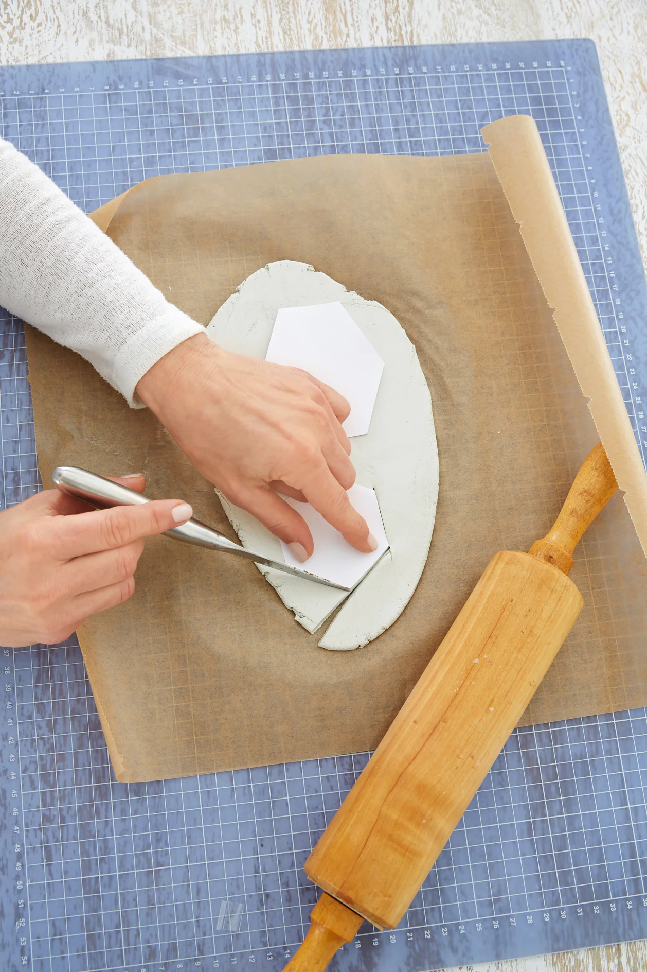 Cutting out hexagons using the templates out off the modeling clay.