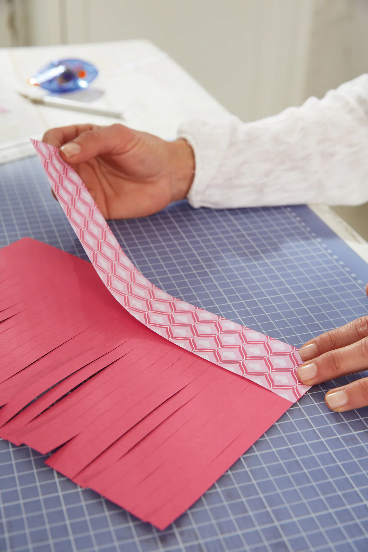 DIY Valentine's Day Lanterns / Step 4: Stick strips to the cardboard