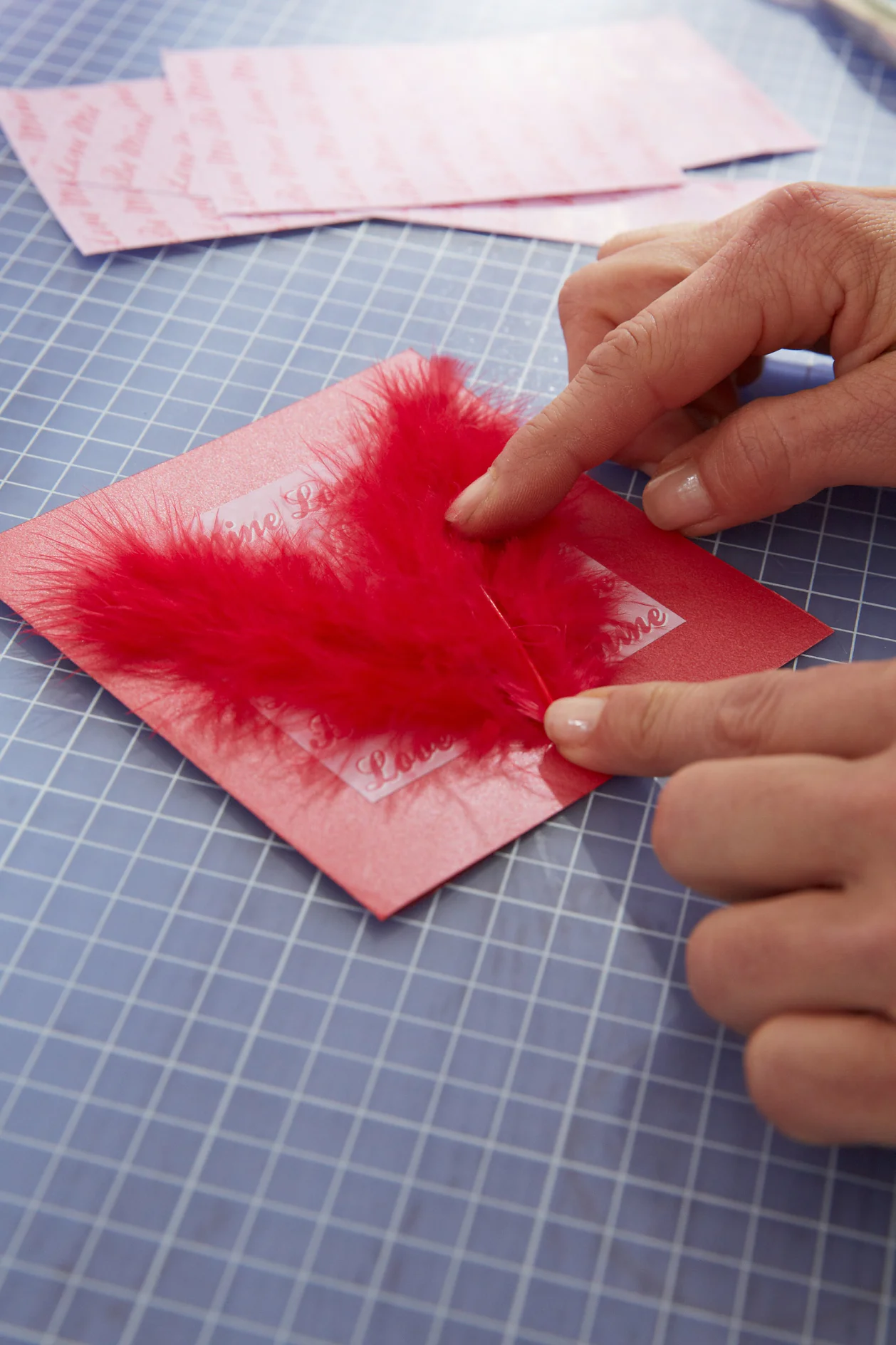 DIY Valentine's Card / Step 4: Stick on feathers