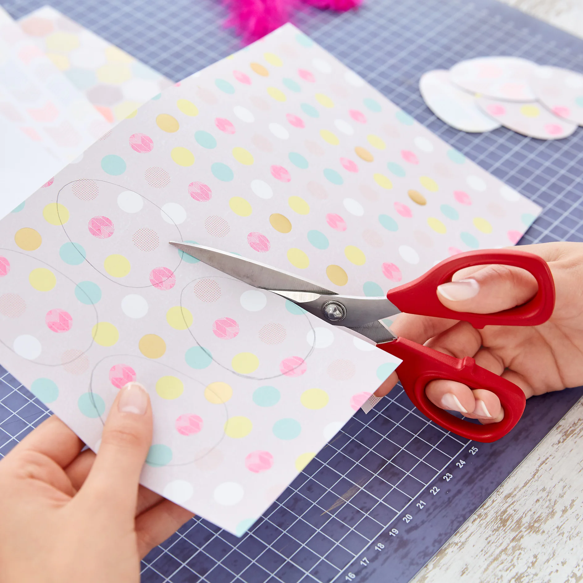 For these lovely Easter decorations, cut out a smaller egg template; using a pencil trace two eggs per hanger on the cardboard and cut them out.