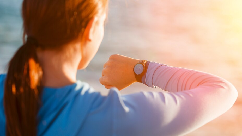 tesa-woman-looking-at-smartwatch tesa-woman-looking-at-smartwatch