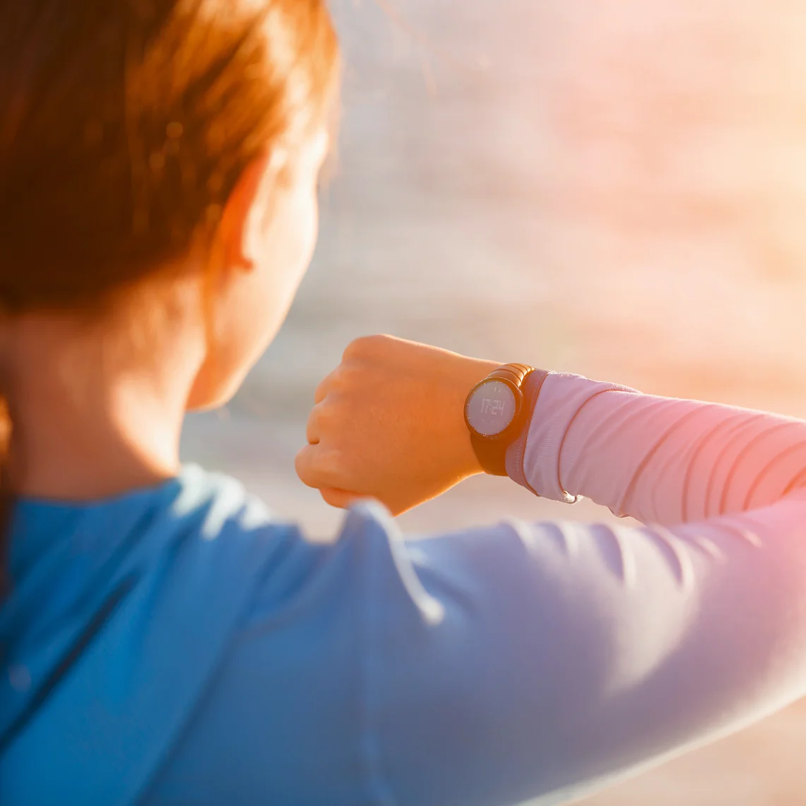 tesa-woman-looking-at-smartwatch