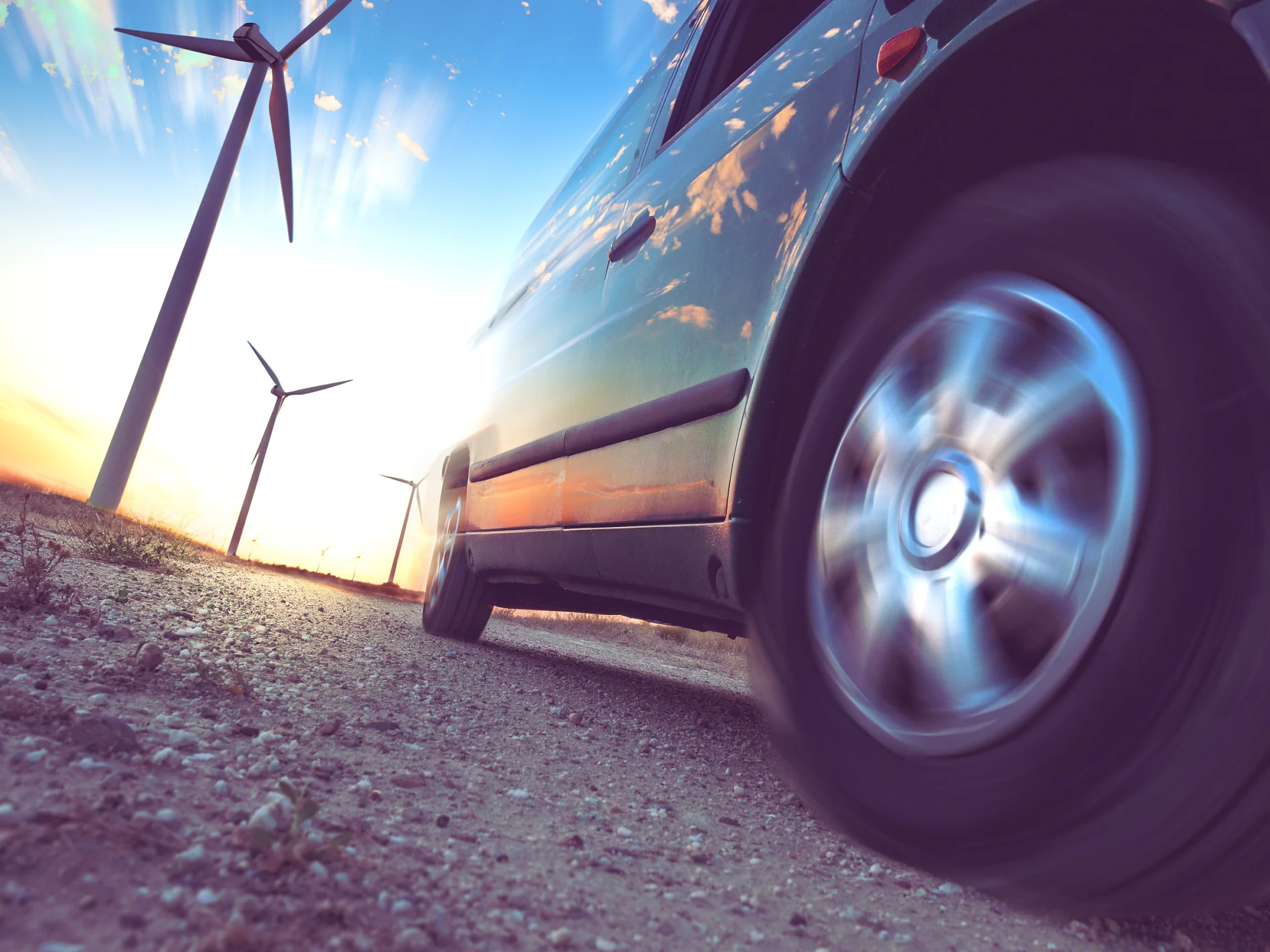 Wind mills and tire car detail.Electricity and ecology