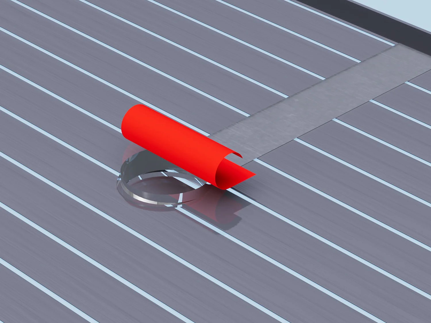 A red, curved object is partially rolled onto a horizontal, gray-striped surface with a narrow strip of tesa tape intersecting the stripes. The background is a light blue area at the top edge of the image. (This text has been generated by AI)