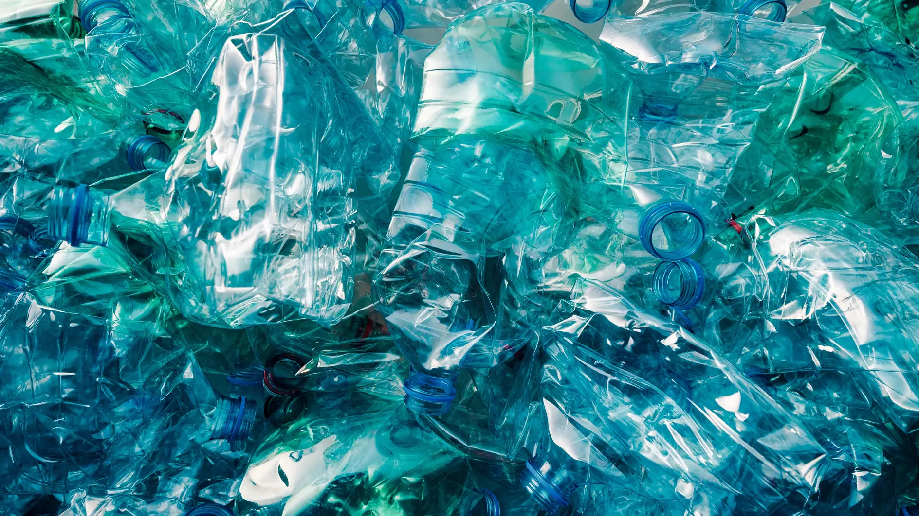 Crushed plastic bottles heap ready for recycling