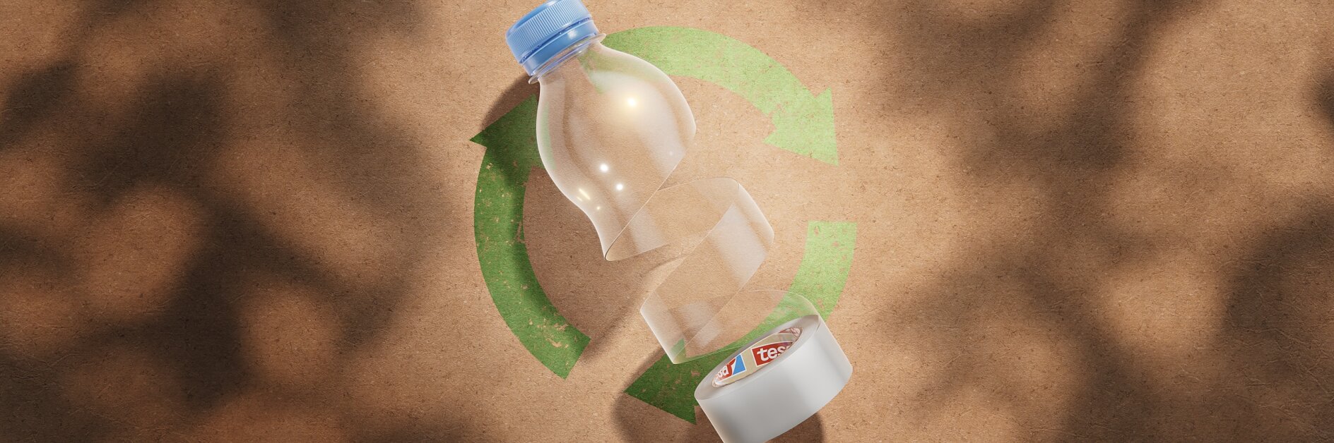 A plastic bottle with sections cut out, laid on a brown surface. Beneath it, a green recycling symbol is visible. The shadow of tree branches partially covers the surface. (This text has been generated by AI)