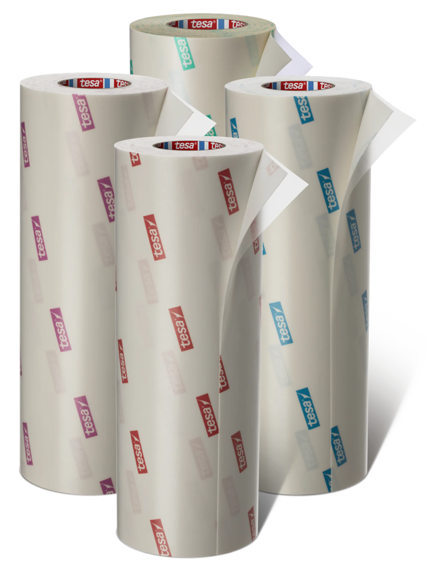 Four rolls of adhesive tesa tape stand upright. Each roll has a partially unrolled section revealing a tesa tape brand pattern in various colors: purple, red, green, and blue. The rolls are arranged in a staggered formation against a plain background. (This text has been generated by AI)