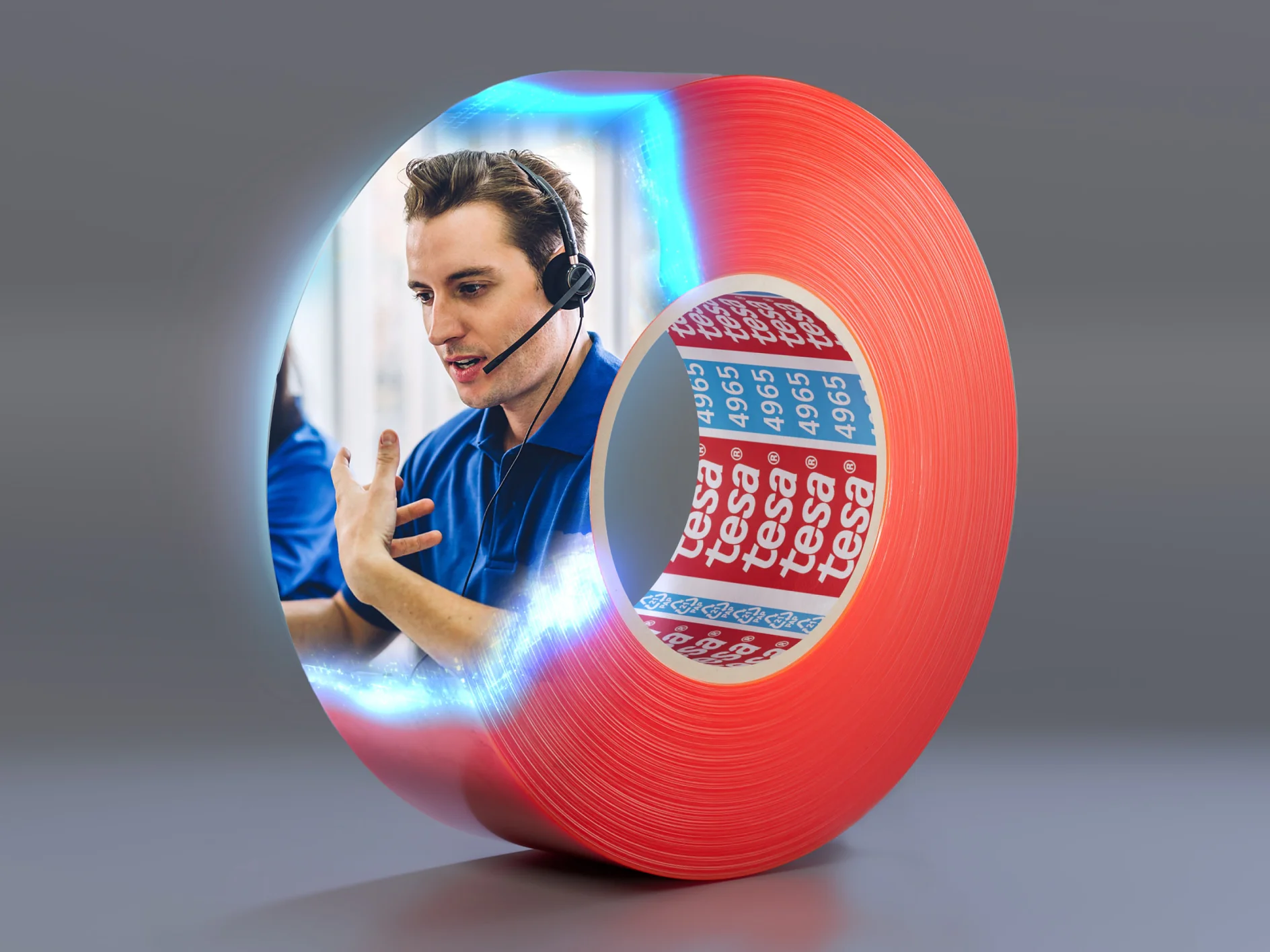A person wearing a headset, speaking animatedly, is digitally blended into the side of a large roll of red adhesive tesa tape. The tesa tape displays the brand name tesa repeatedly on the inner side. (This text has been generated by AI)