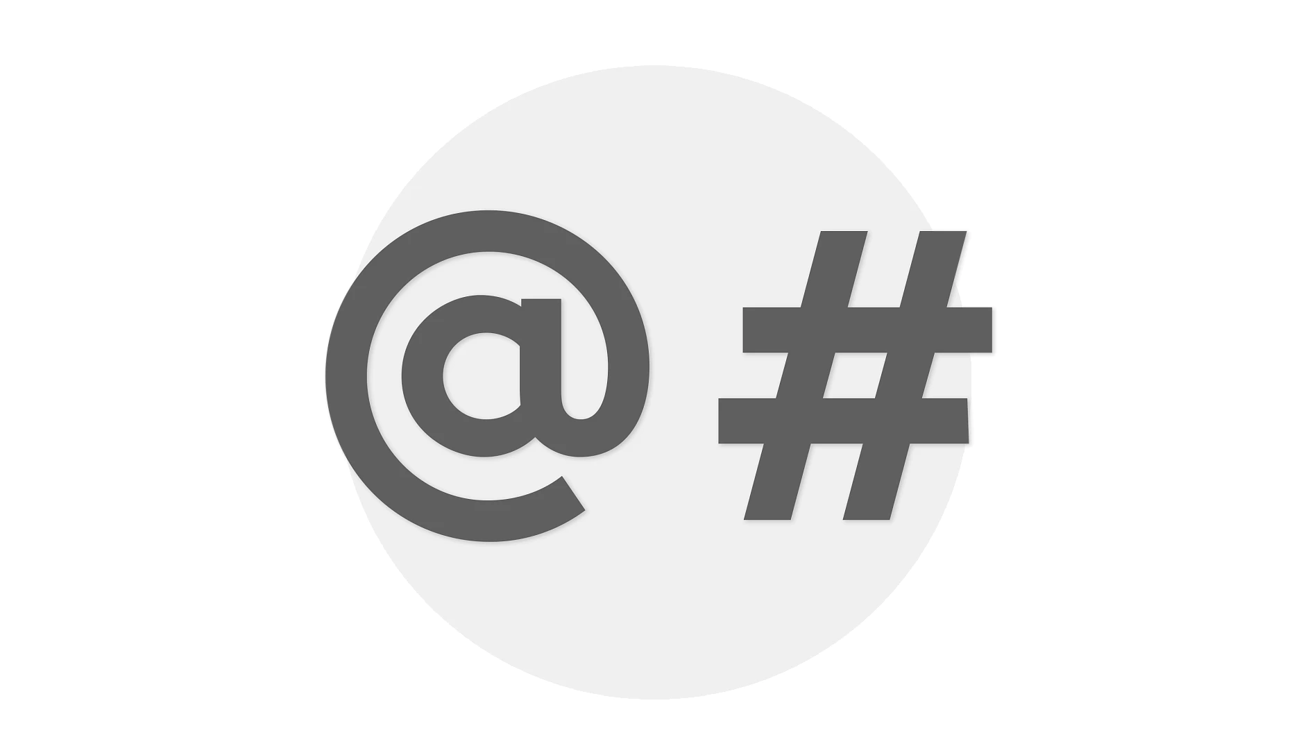 The image shows a large, dark gray @ symbol on the left and a # symbol on the right, both set against a light gray background. (This text has been generated by AI)