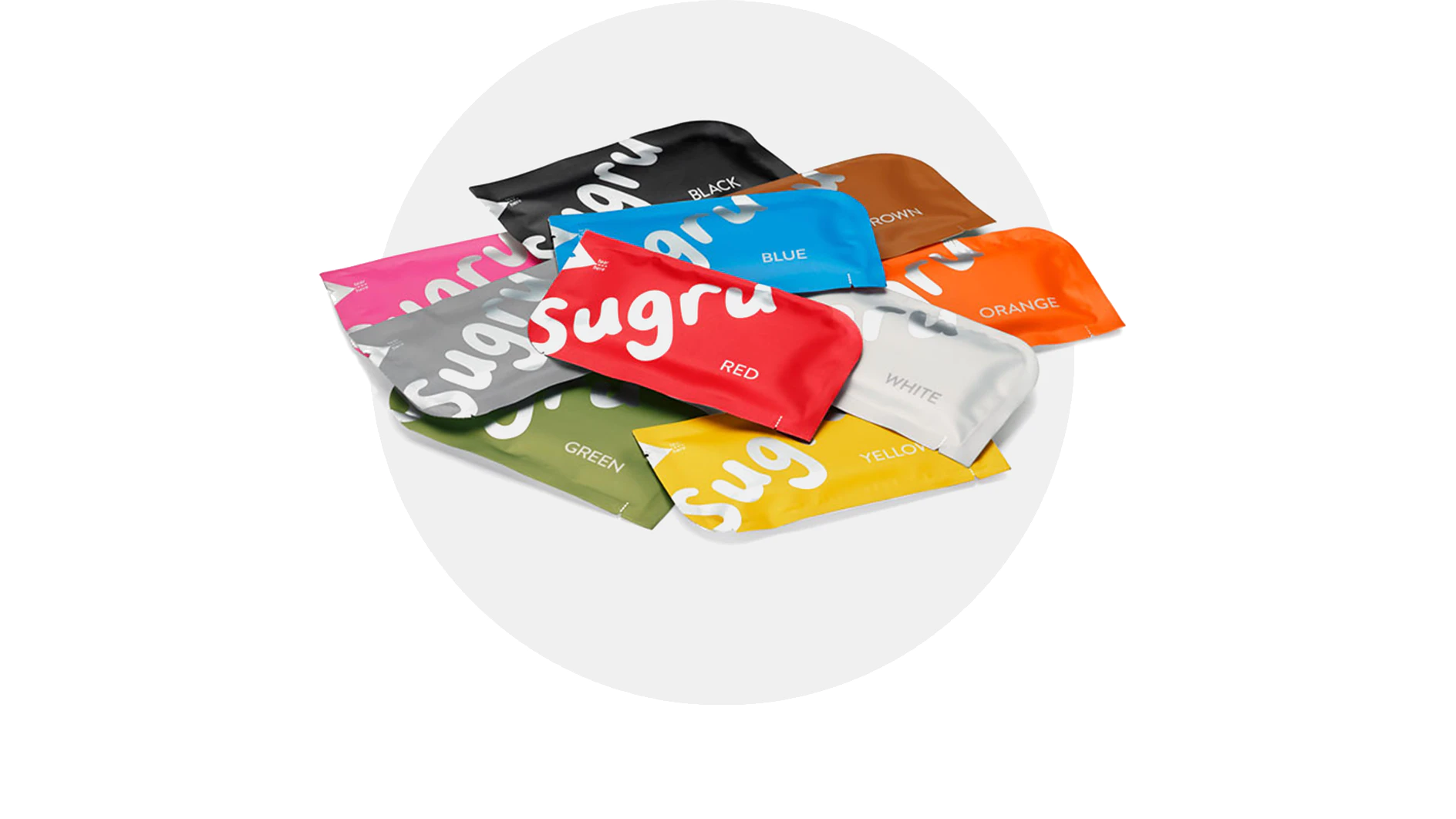 A variety of Sugru adhesive packs are arranged on a white surface. The packs are in different colors: black, brown, orange, white, yellow, red, blue, green, and pink, each with the word Sugru written on them. Additionally, several rolls of tesa tape are displayed alongside these adhesive packs. (This text has been generated by AI)