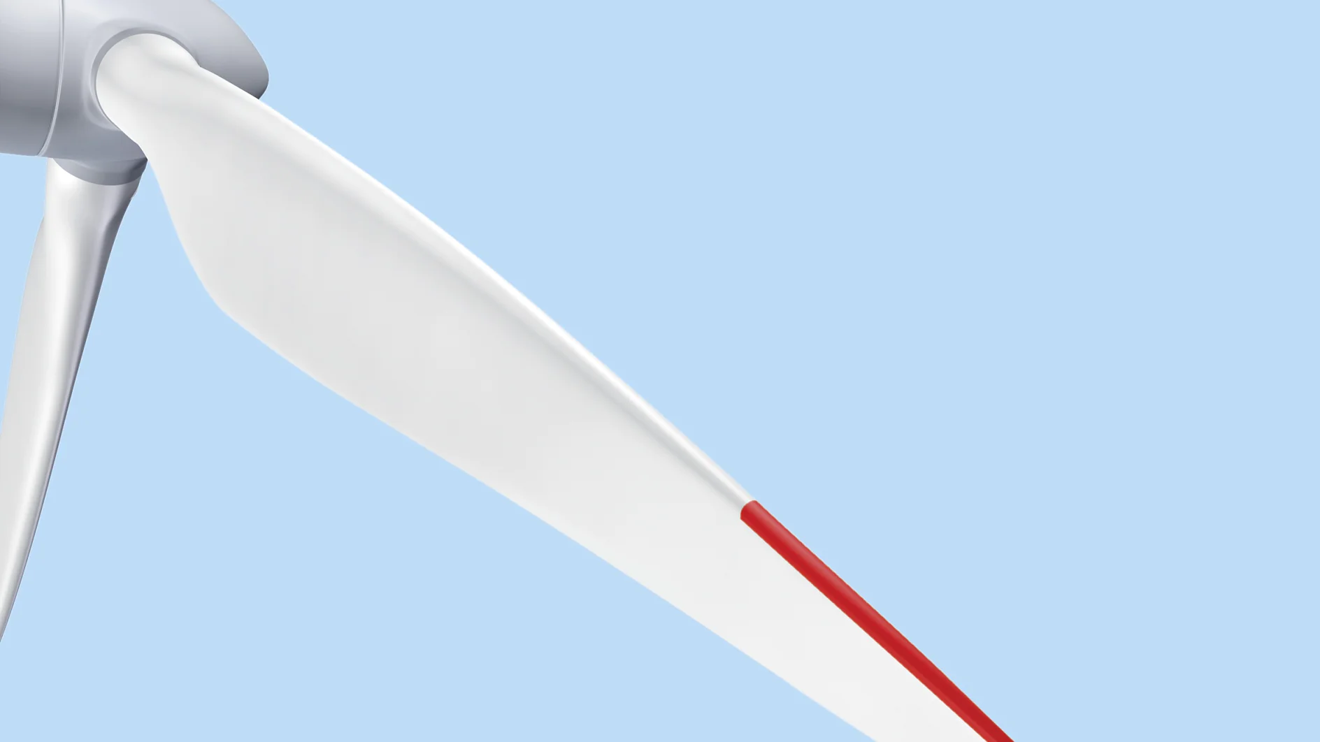 Close-up view of a wind turbine blade set against a clear blue sky. The blade is white with a red tip, and part of the turbines hub and another blade are partially visible. (This text has been generated by AI)