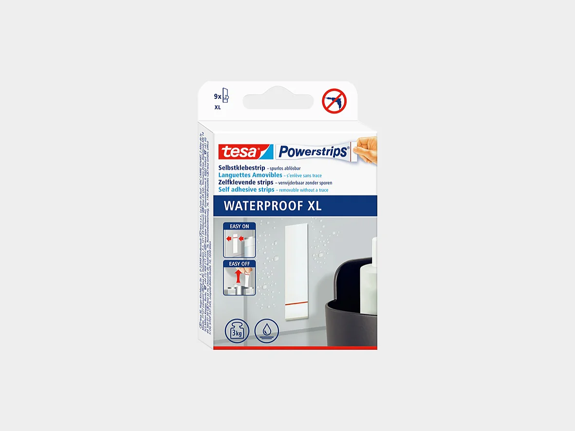 A box of tesa Powerstrips Waterproof XL is shown against a plain background. The packaging is predominantly white and blue, with product usage illustrations and branding visible on the front. (This text has been generated by AI)