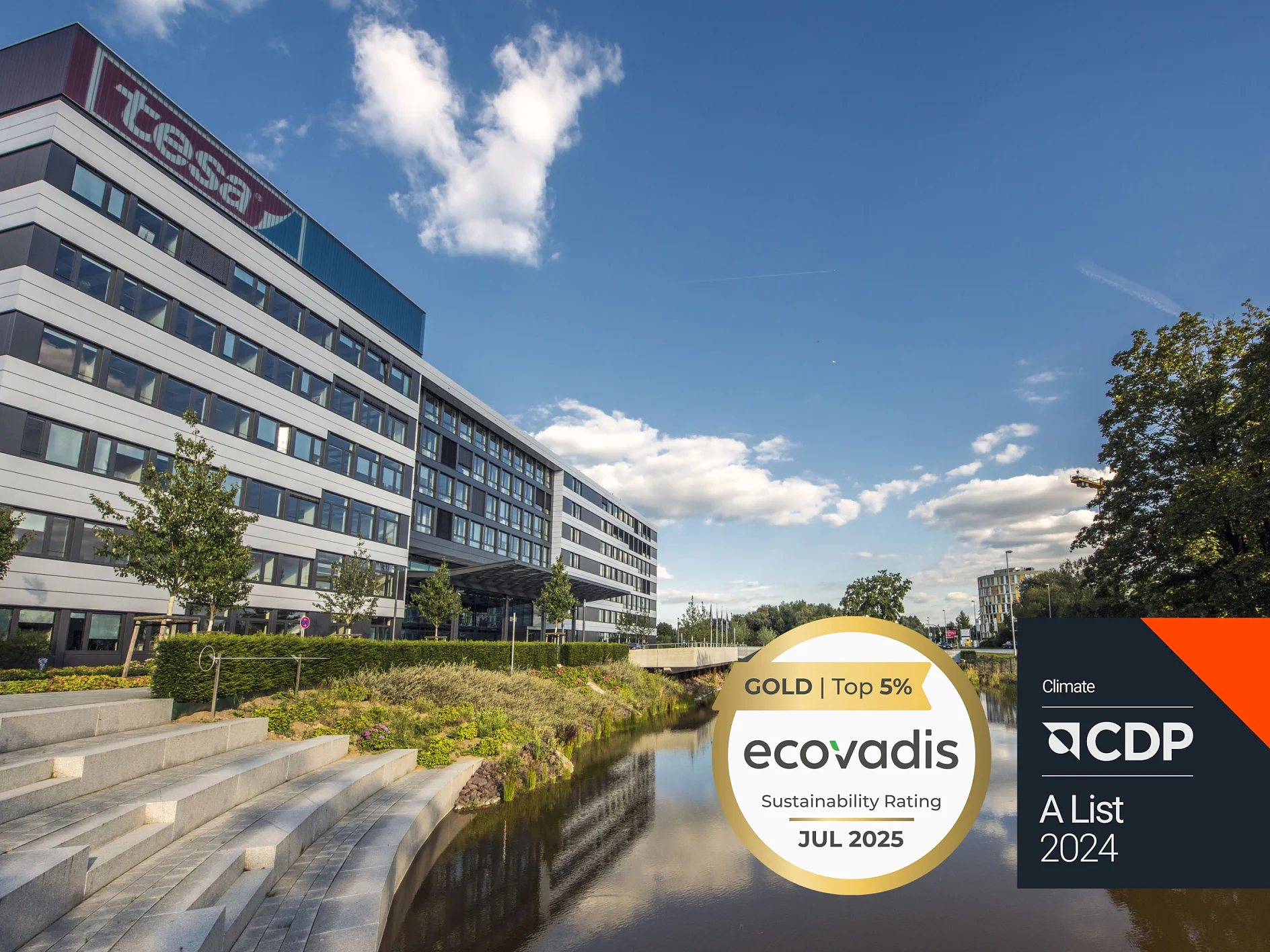 A modern office building with a large tesa tape sign, landscaped steps, a canal, and trees. Overlay displays EcoVadis Gold Sustainability Rating for July 2025 and CDP A List 2024 for climate. (This text has been generated by AI)