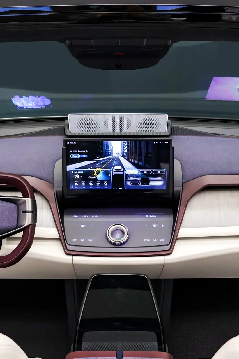 View of a modern car interior from the back seat, featuring white leather seats, digital dashboard, central display, and tesa tape used in trim. (This text has been generated by AI)