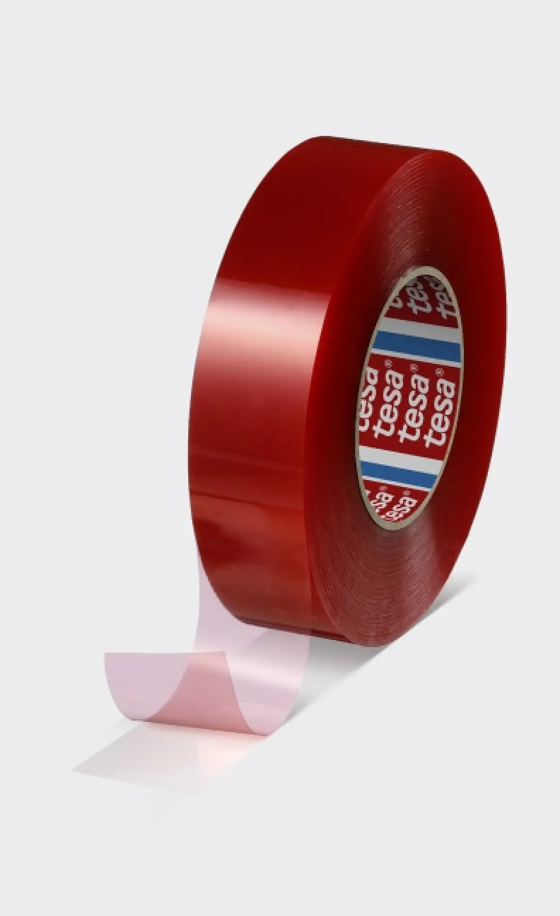 A roll of red tesa tape with a partially unrolled, transparent end. The inner ring shows the tesa brand on red and blue. Plain gray background. (This text has been generated by AI)