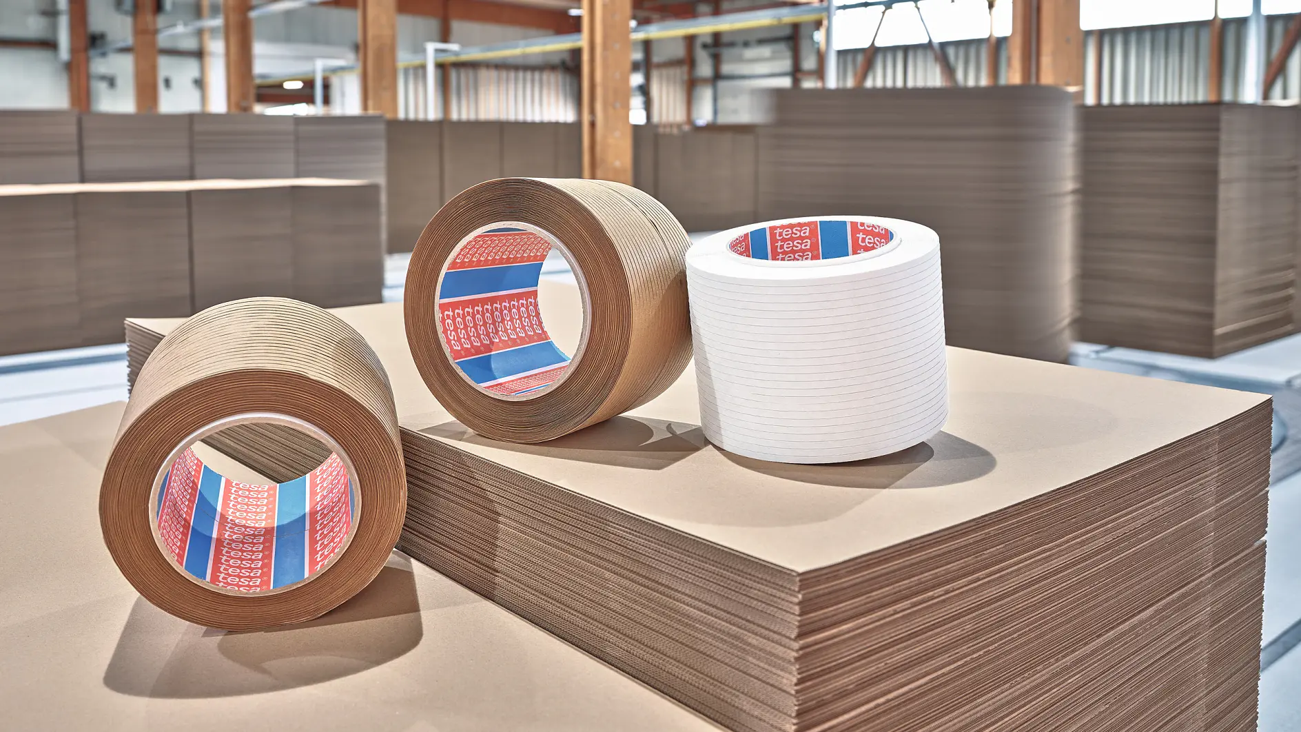 Paper-based tear tapes on a stack of cardboard (This text has been generated by AI)