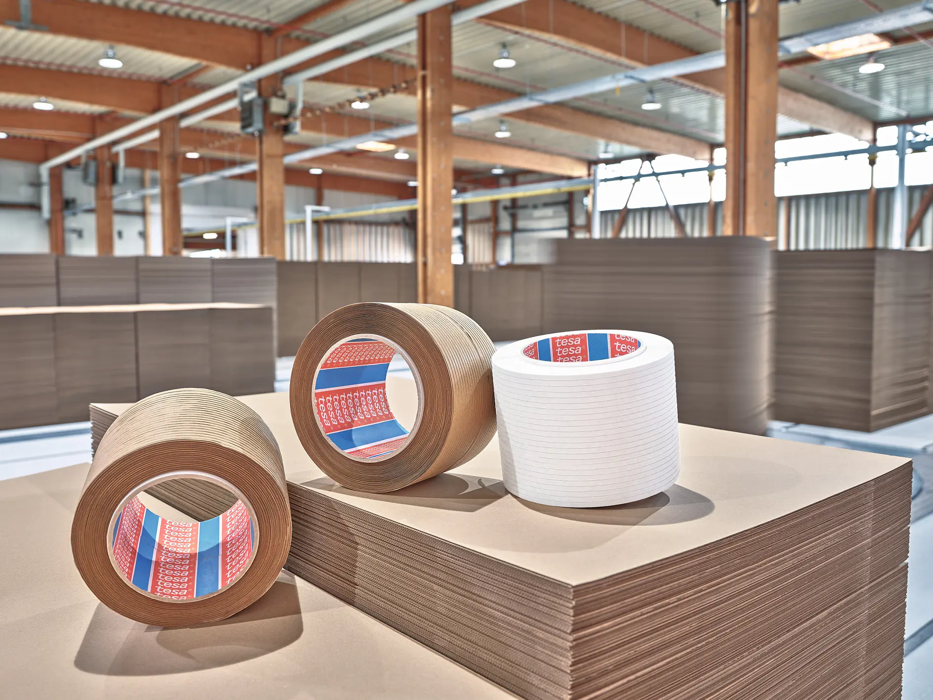 Paper-based tear tapes on a stack of cardboard (This text has been generated by AI)