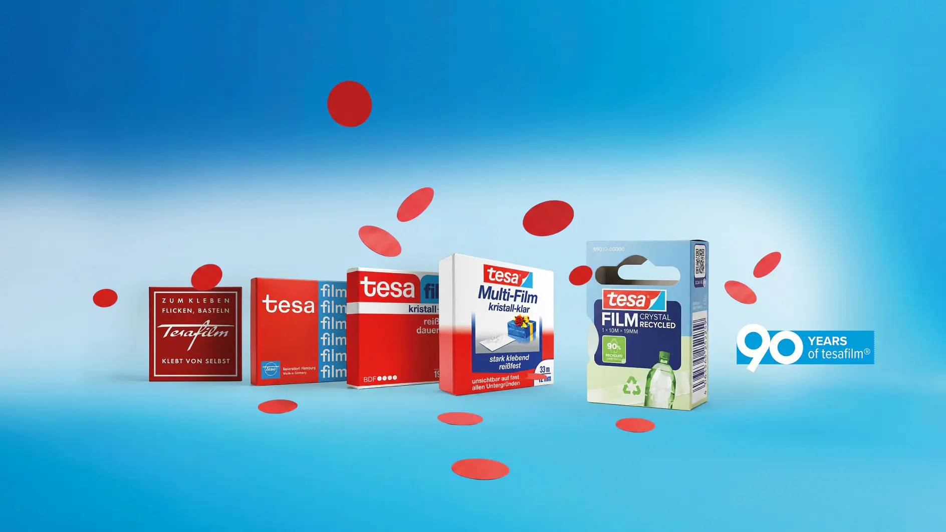 Five boxes of tesa tape are arranged in a row on a blue background with red dots and a 90 years of tesa tape logo on the right.