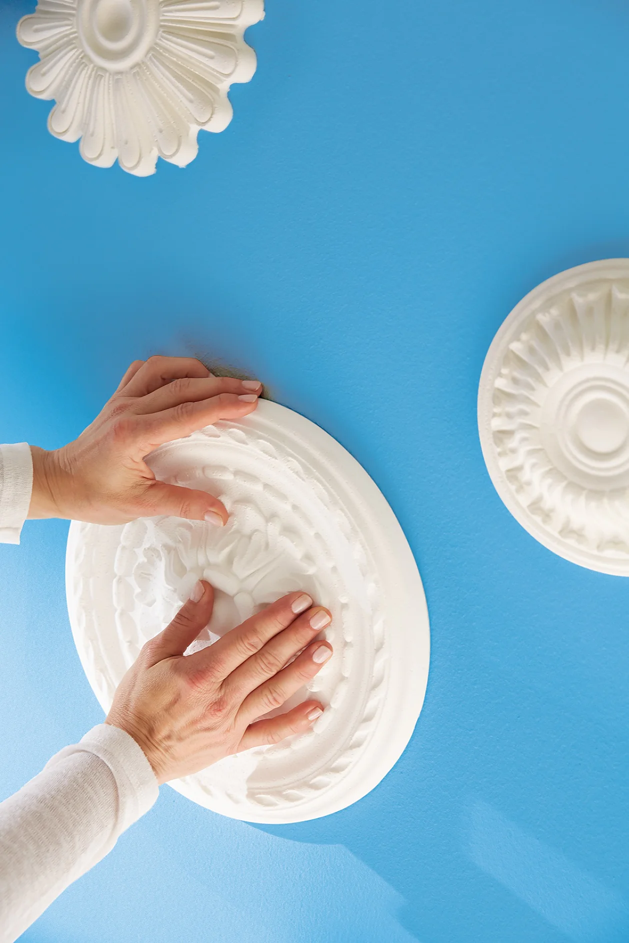 Mark the desired positions of the rosettes and bar on the wall.