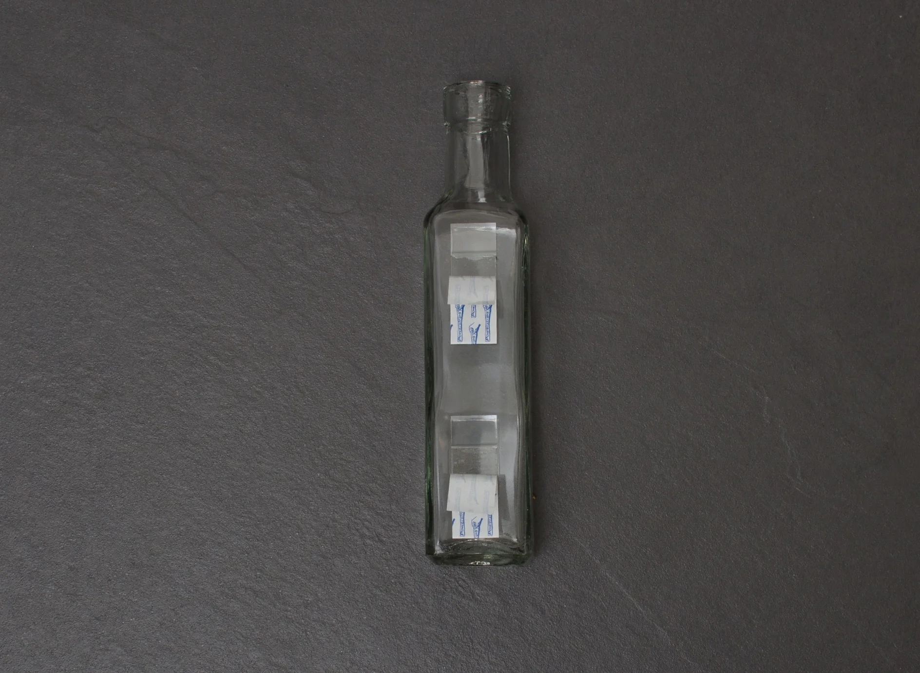 Attach the bottles to your chosen surface in the bathroom using tesa tesa Powerstrips® Strips Transparent Large.