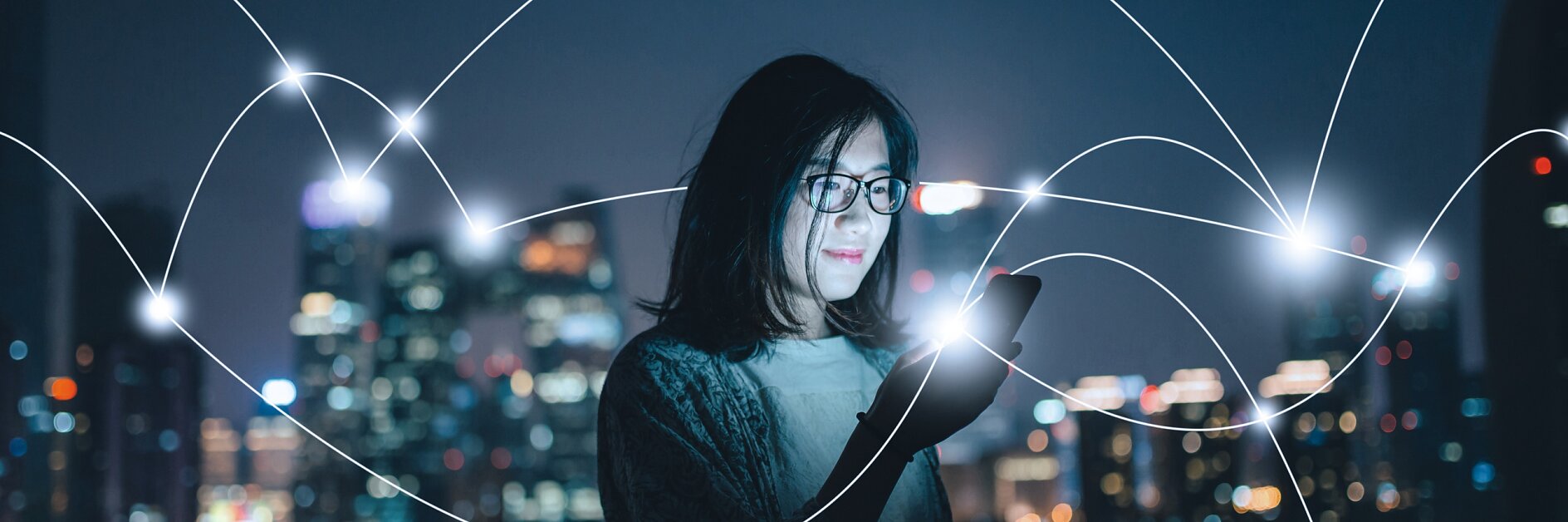 tesa woman smartphone city night