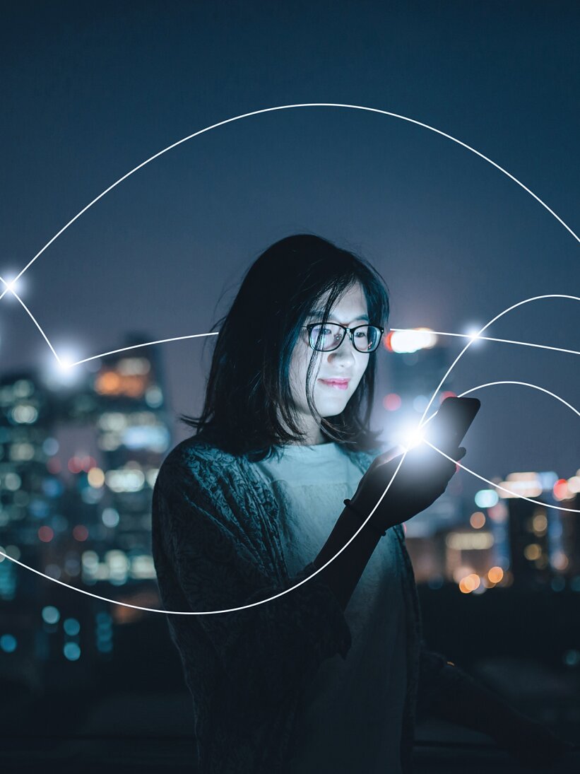 tesa woman smartphone city night