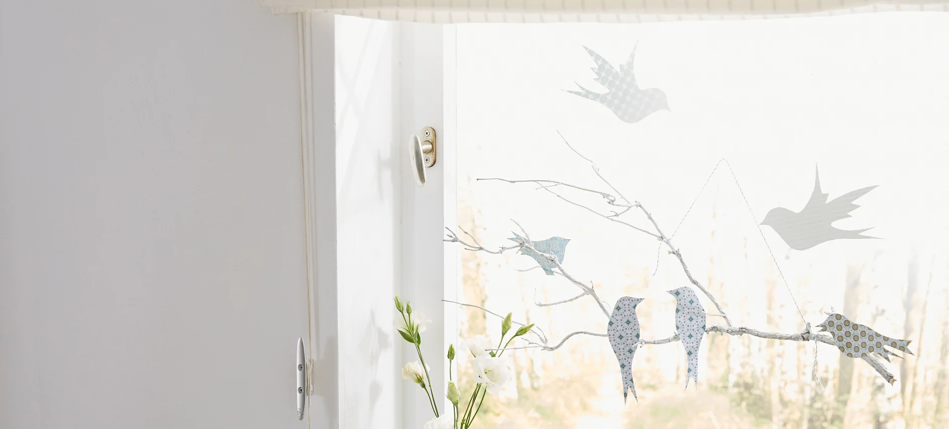 Window decoration: "Birds on branch"