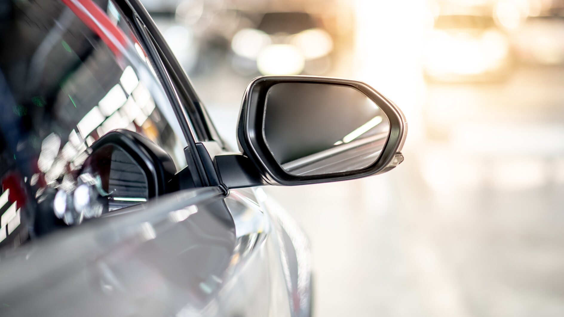 Metallic wing mirror of modern car Close up of metallic wing mirror of modern car. Auto transport or automobile industry concepts