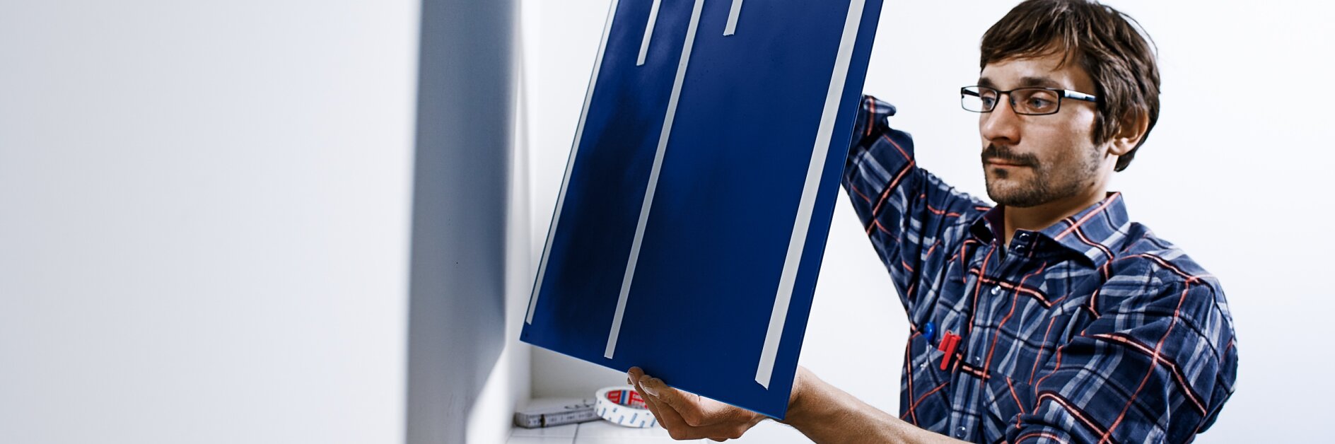 Extra-strong mounting tape for affixing heavy objects like mirrors