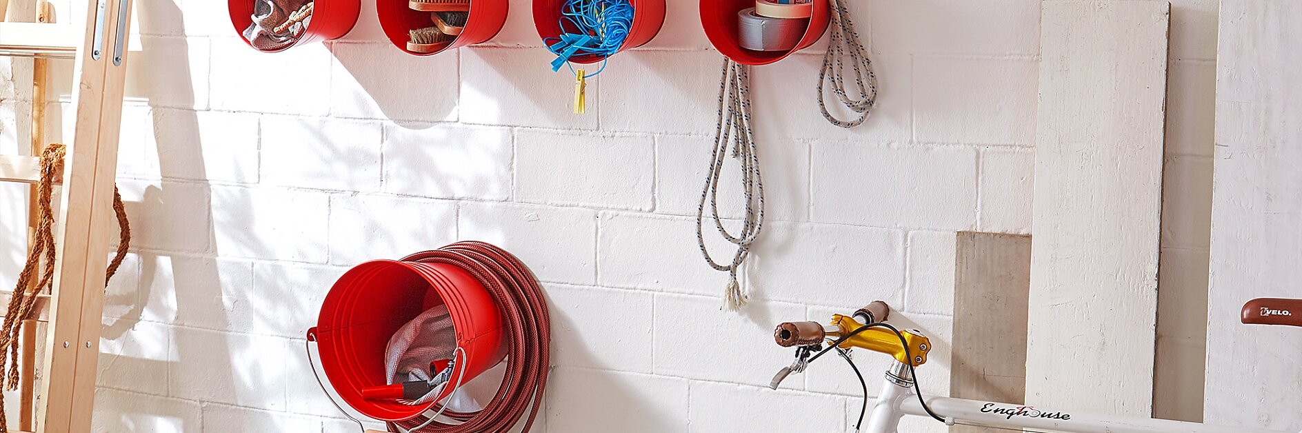 Create a clever garden hose storage solution.