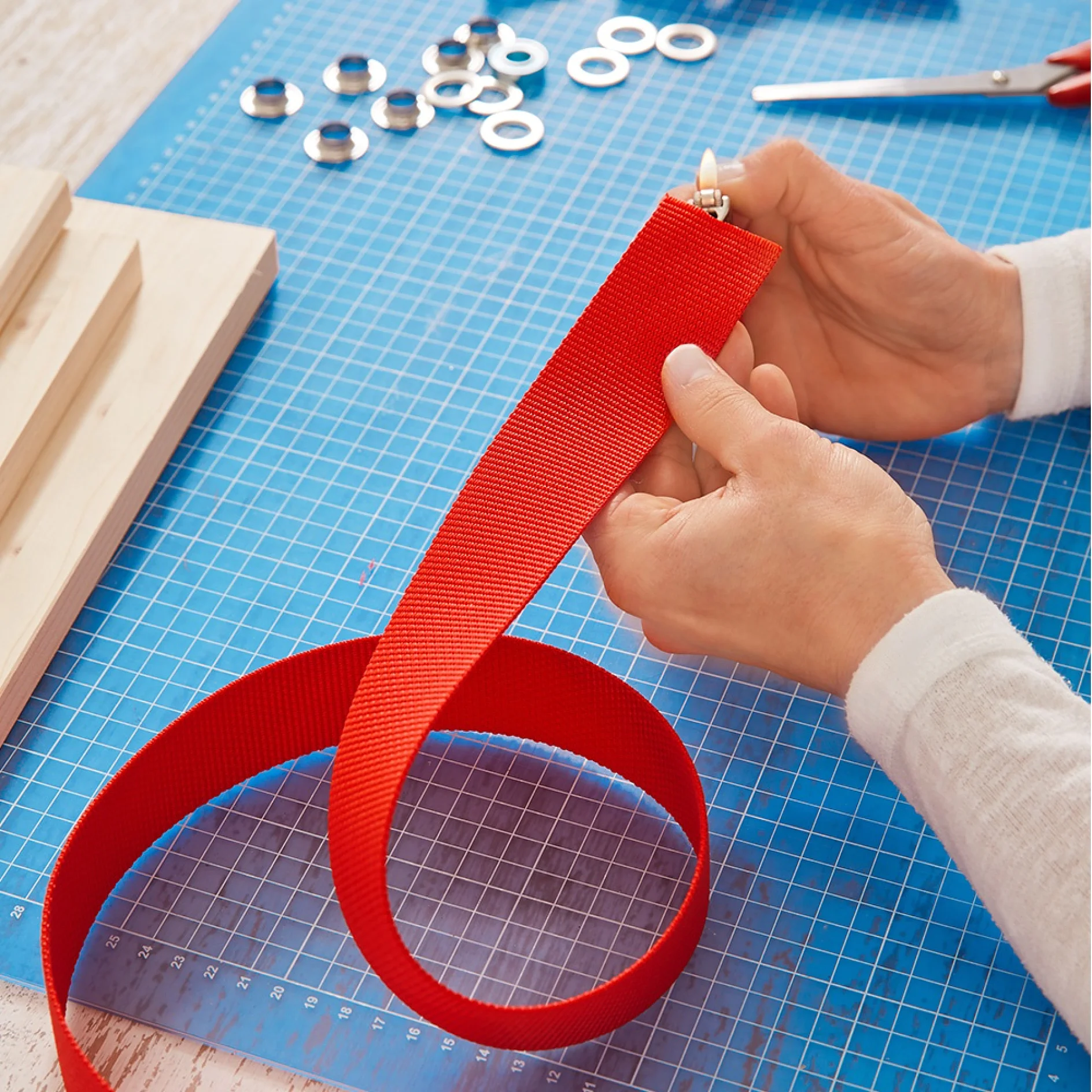 Sealing the ends of the straps to prevent fraying when making wall mounted herb racks.