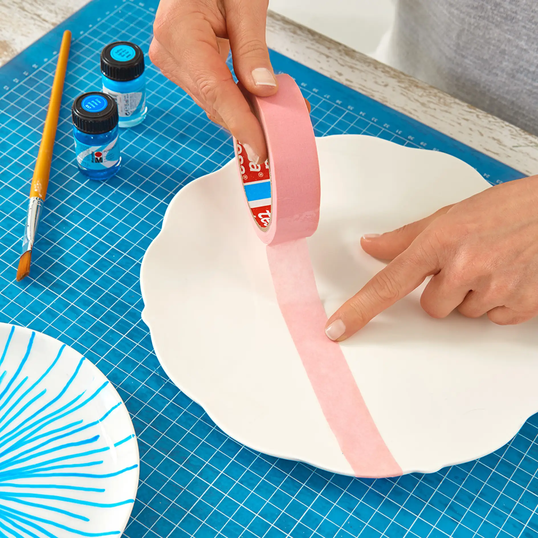 Using tesa® Masking Tape for Wallpaper while making DIY wall plates.