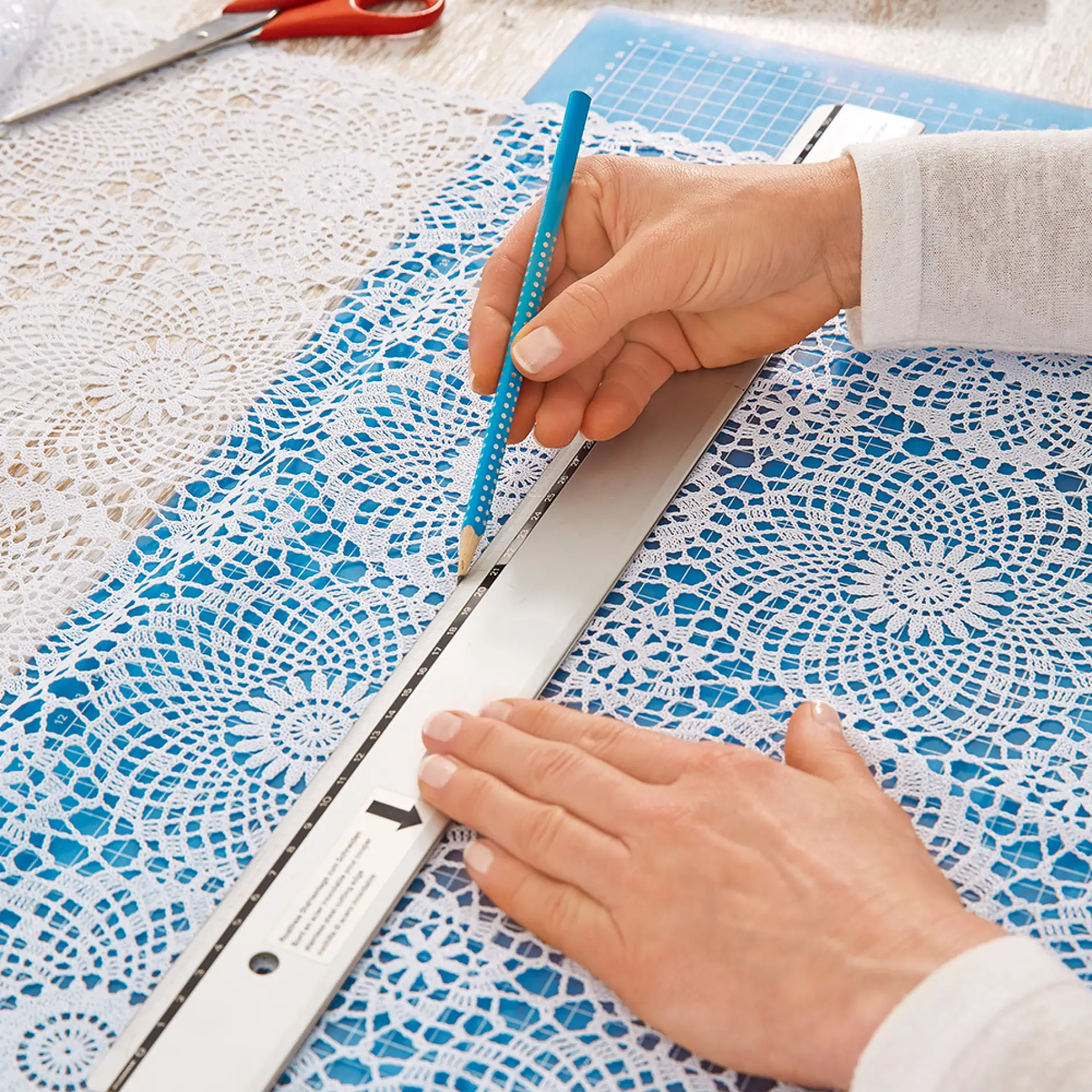 Measuring and marking while making a DIY lace window treatment