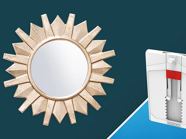 A sunburst-style mirror with a gold border is on the left. On the right, there is a white packaging of tesa tape, featuring a gray hook. The background is split between dark teal and light blue. (This text has been generated by AI)