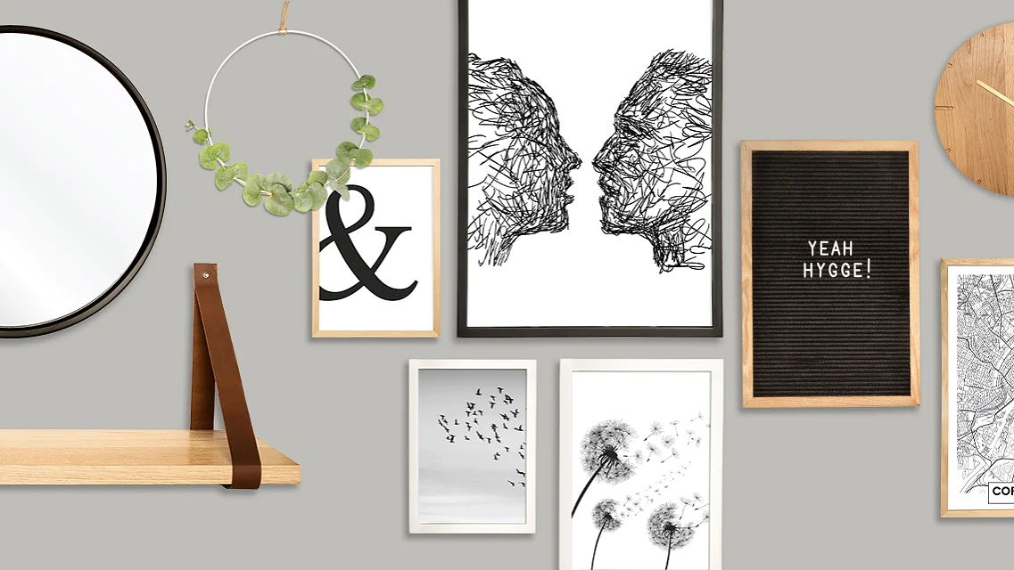 A wall adorned with various decor items: a round mirror, a wooden shelf, a circular plant holder, a series of framed artworks (ampersand, abstract faces, birds, dandelions), a clock, a letter board with YEAH HYGGE!, and a map of Copenhagen. (This text has been generated by AI)