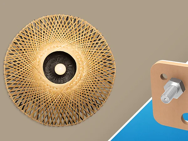 A woven wicker lampshade with a light bulb inside is on the left. On the right, a wooden board secured with a bolt and washer is set against a blue background using tesa tape. (This text has been generated by AI)