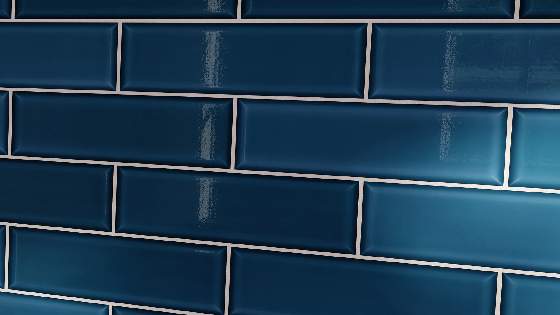 Close-up of a wall with glossy dark blue subway tiles arranged in a staggered pattern. The tiles are rectangular with slight bevels and reflect light, creating a shiny surface. (This text has been generated by AI)