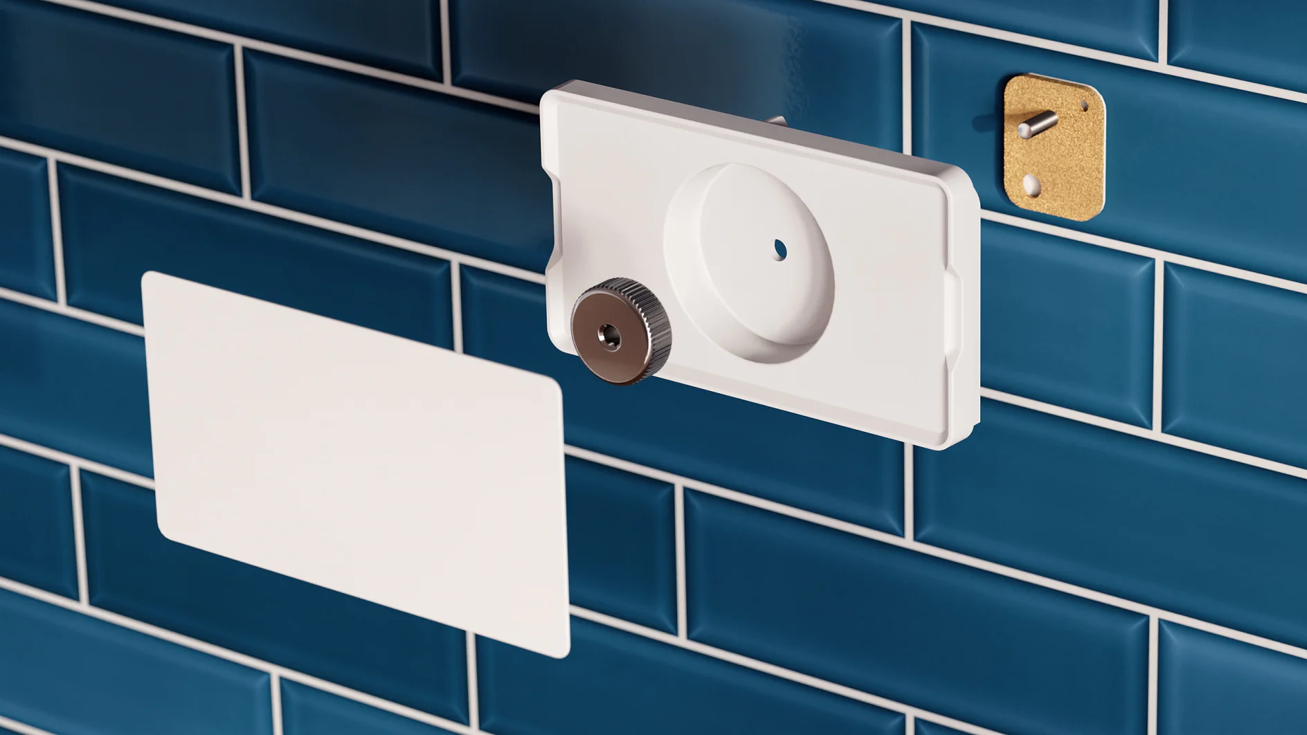 A white, rectangular object with a circular opening and a metallic knob is mounted on glossy blue subway tiles using tesa tape. A similar white piece is secured flat against the tiles with tesa tape, while a small gold plate with a hole is affixed nearby. (This text has been generated by AI)
