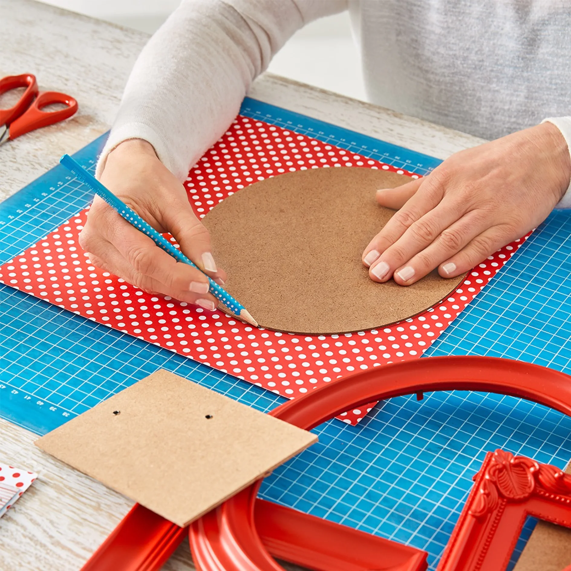 Tracing around frame backs when making a DIY gallery wall