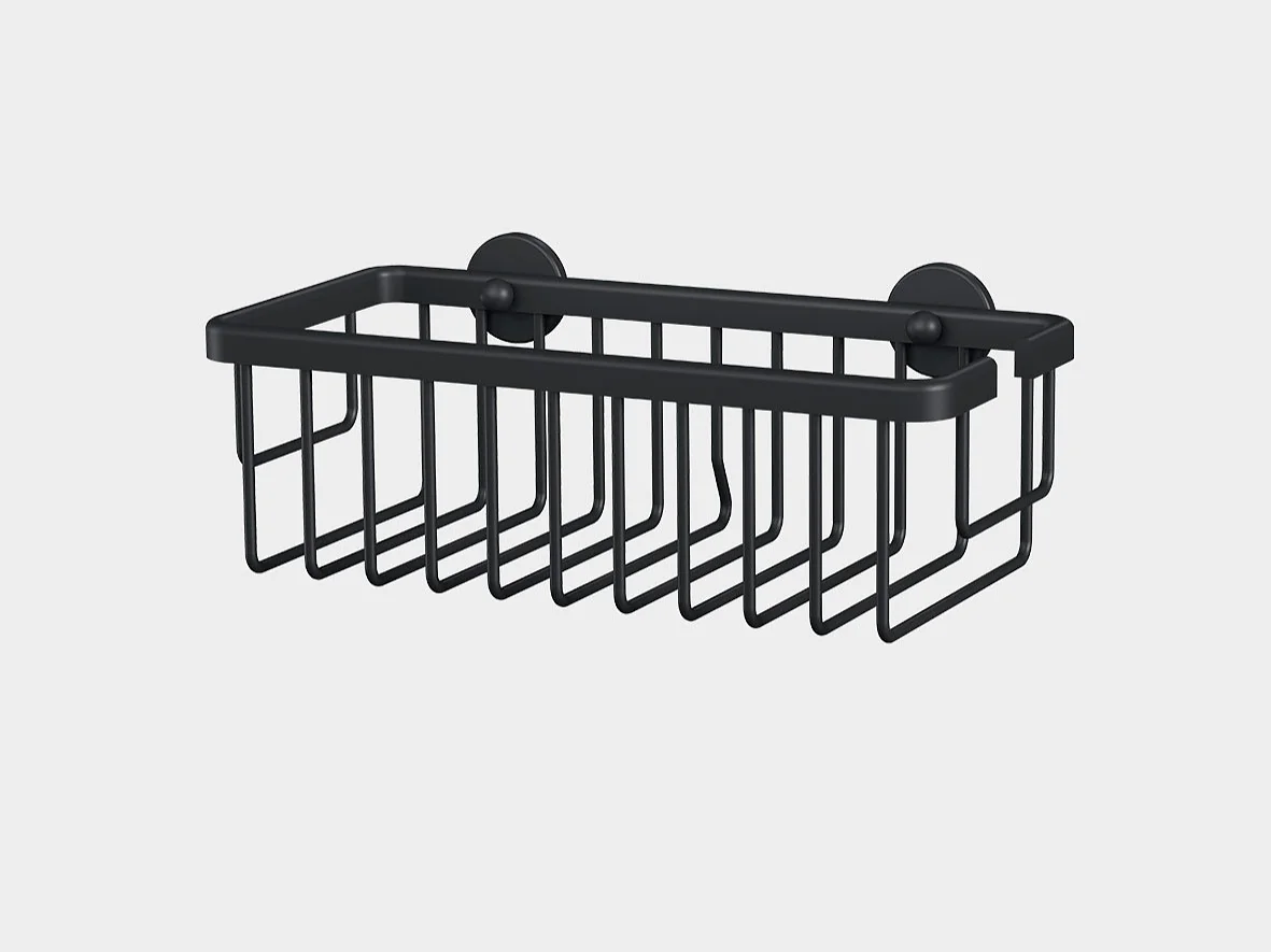 A black metal wall-mounted wire basket with two suction cups for attachment using tesa tape. The basket has a rectangular shape and open grid design, suitable for holding small items. The background is plain white. (This text has been generated by AI)