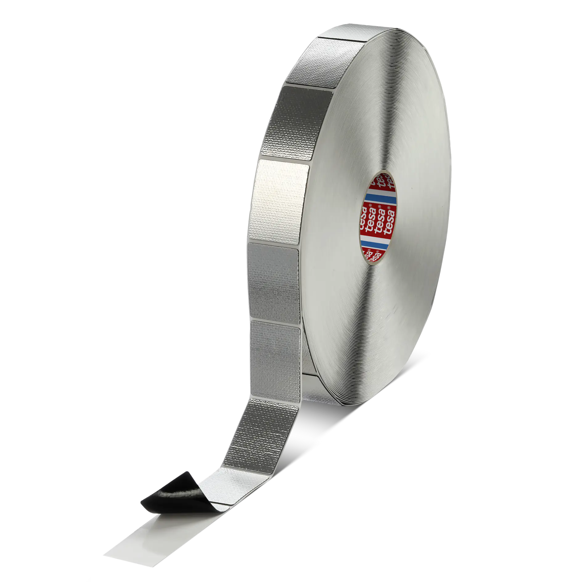 A roll of metallic adhesive tesa tape with a partially unrolled section showcasing a black adhesive side and a silver reflective side. The tesa tape is positioned upright against a plain background.
