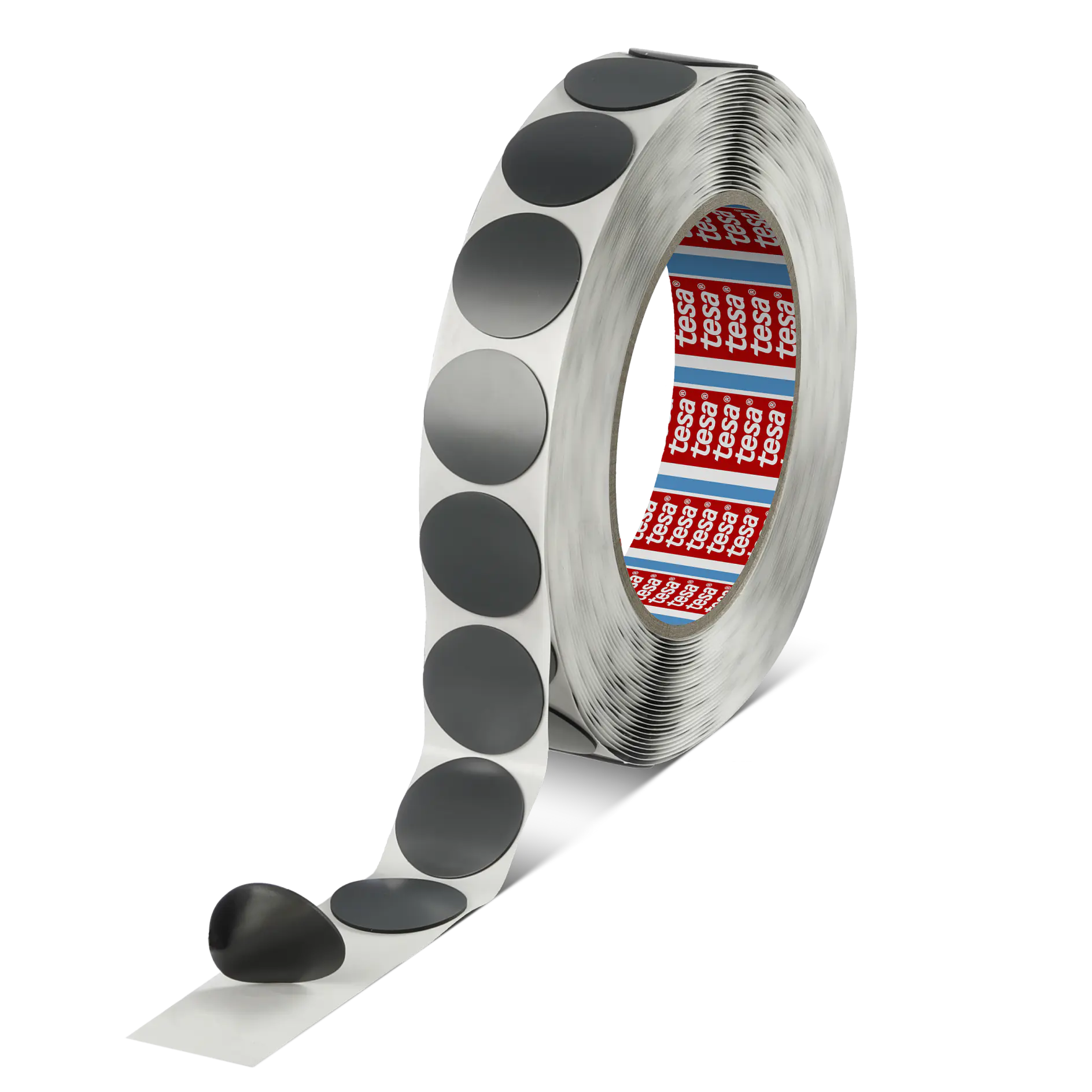 A roll of adhesive tesa tape with black circular stickers. The roll is partially unwound, revealing several stickers attached to a white backing strip. The inside of the roll features red and white branding text.